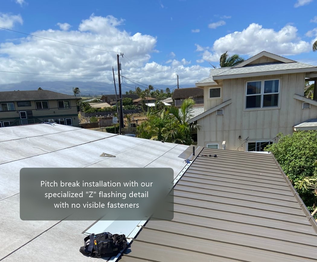 Pitch break installation with Z flashing detail, no visible fasteners