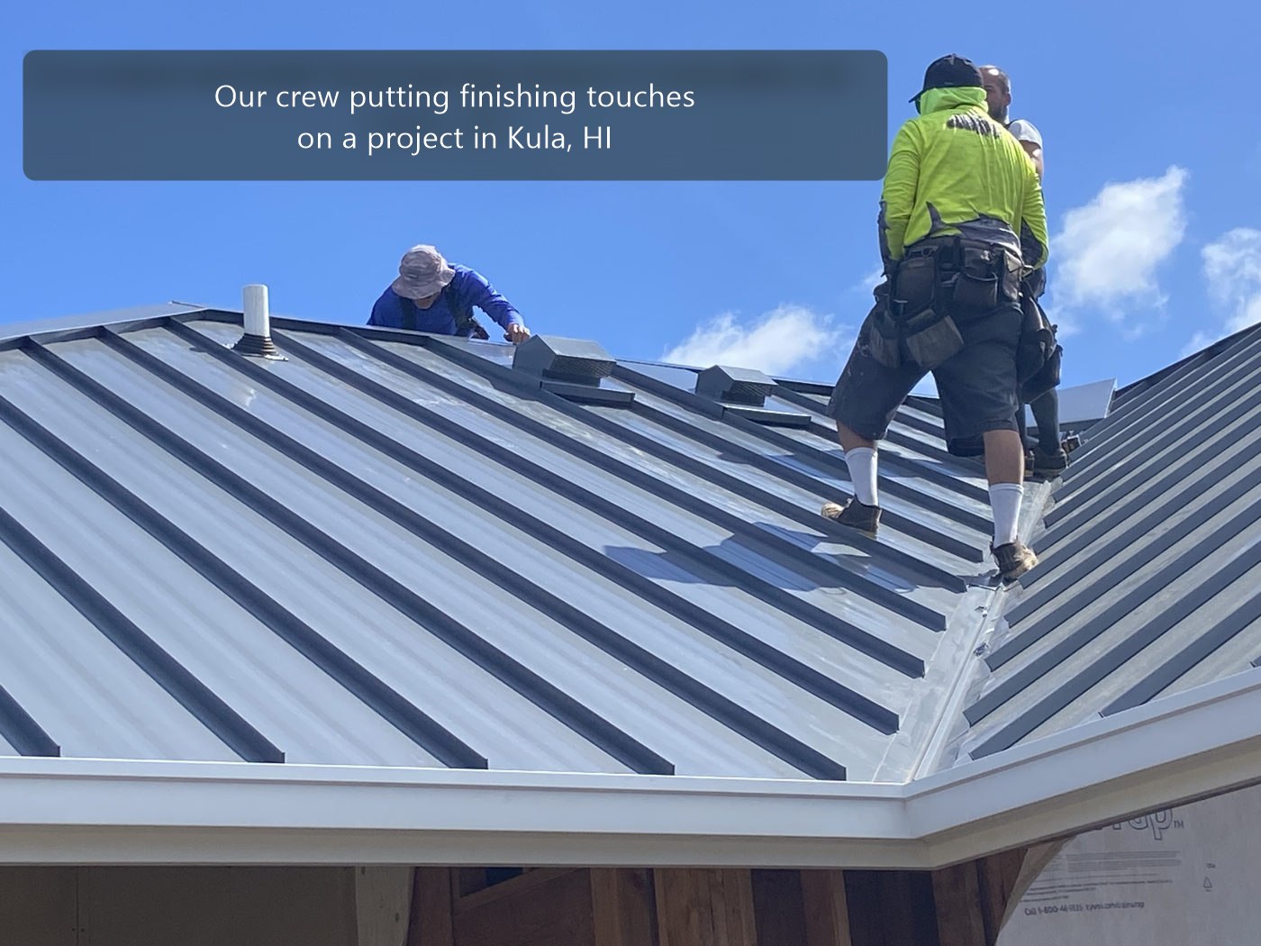 Crew putting finishing touches on a project in Kula